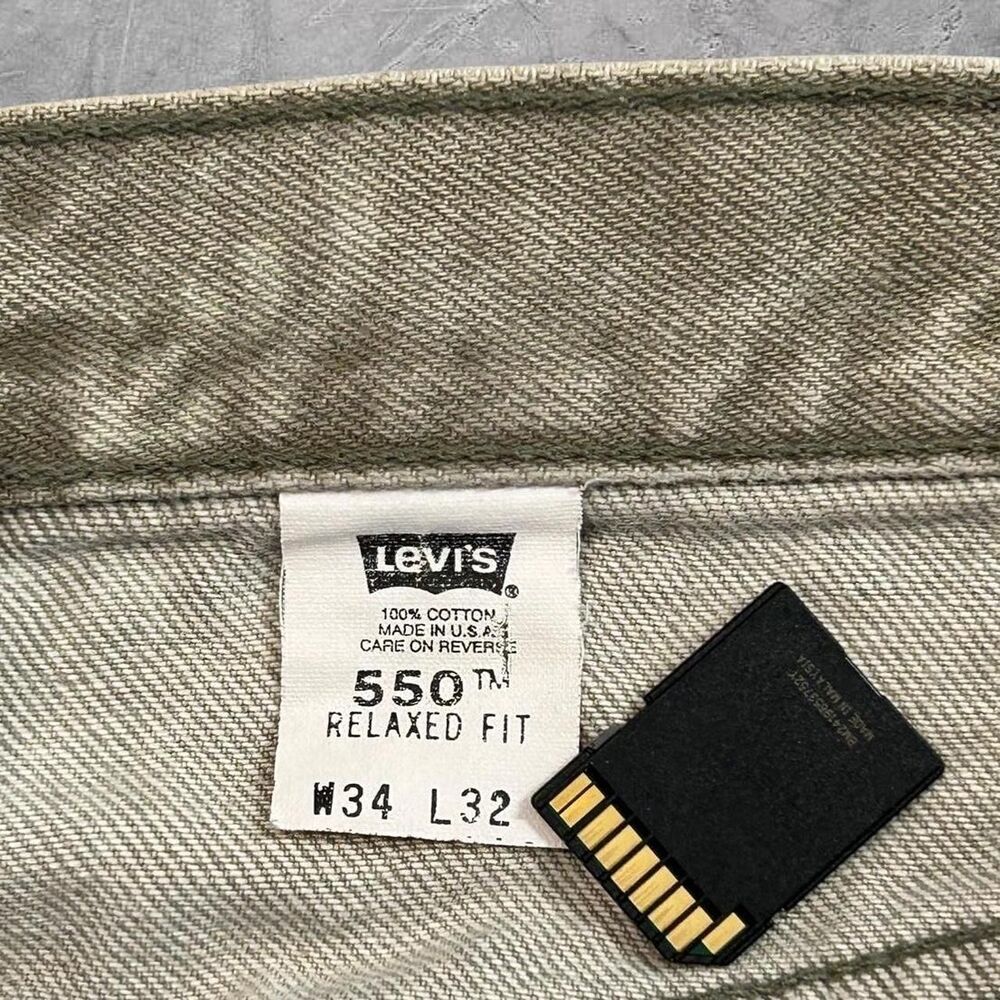 Made in USA Levi's 550 vintage 90s relaxed fit faded grey denim jeans
